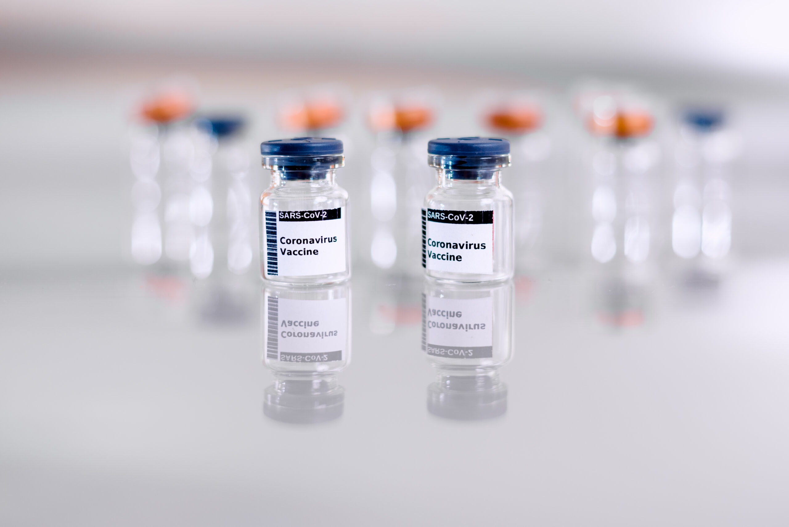 coronavirus vaccine vials on reflective surface 2026 01 05 06 20 42 utc scaled